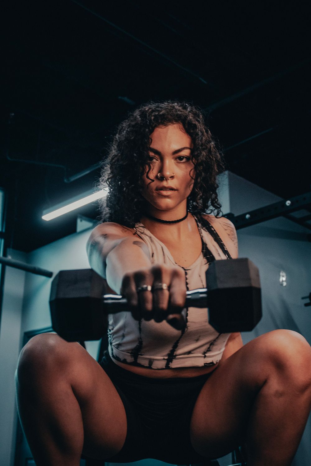 Woman performing strength training in a gym